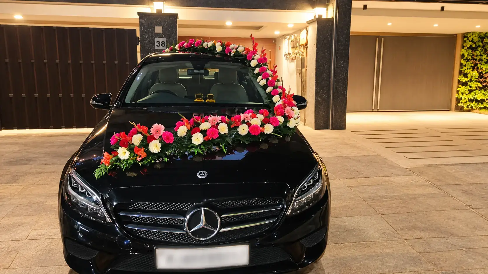 Wedding car decorated with flowers and ribbons
